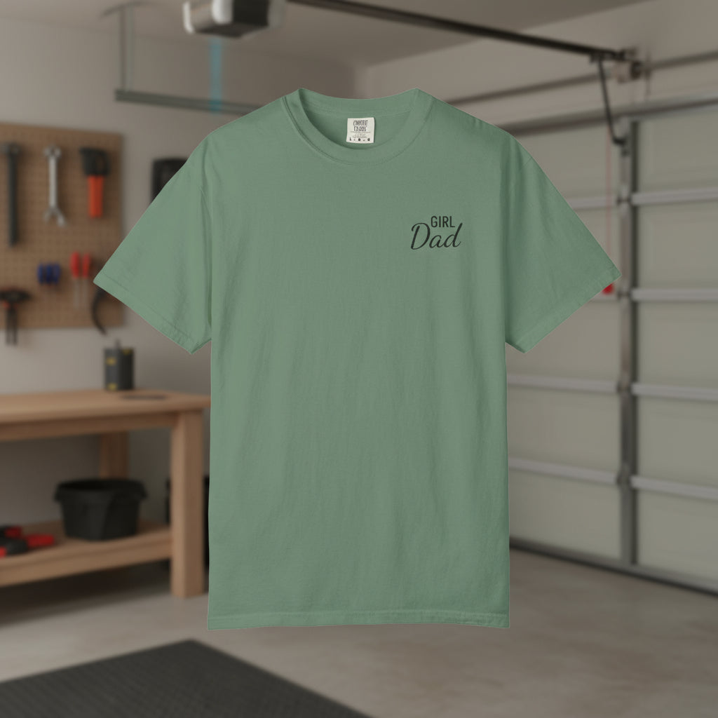 Green t-shirt with 'Girl Dad' text in a garage setting