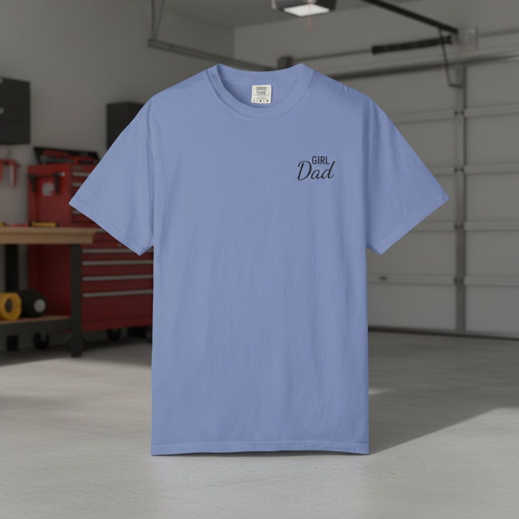 Light blue t-shirt with 'Girl Dad' text in a garage setting