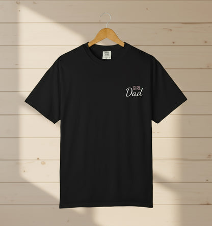 Black t-shirt with 'Girl Dad' text on a wooden background