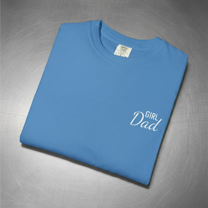 Folded blue t-shirt with 'Girl Dad' text on a white background