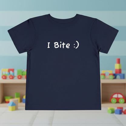 Navy blue t-shirt with 'I Bite :)' text in a playroom setting