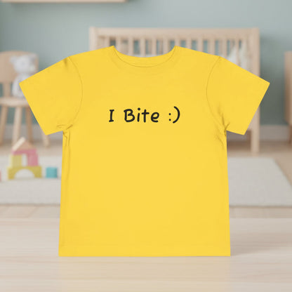 Yellow t-shirt with 'I Bite :)' text on a white background